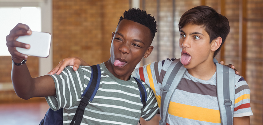 Should you follow your kids on social media__InsideImage Kids having fun taking selfies
