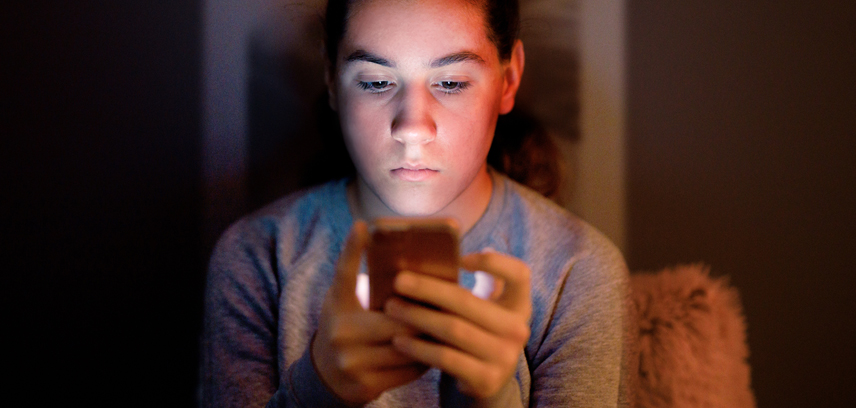 Should you follow your kids on social media__InsideImage A teen victim of sextortion looking at phone