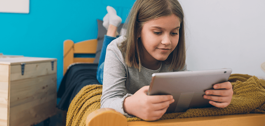 2024-06-Blog_Is-Roblox-Safe-for-kids_InsideImage Young girl playing Roblox on tablet